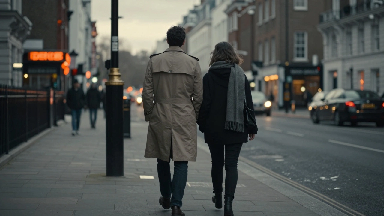 Two people walk side by side in a quiet London street, their close proximity conveying unspoken connection.